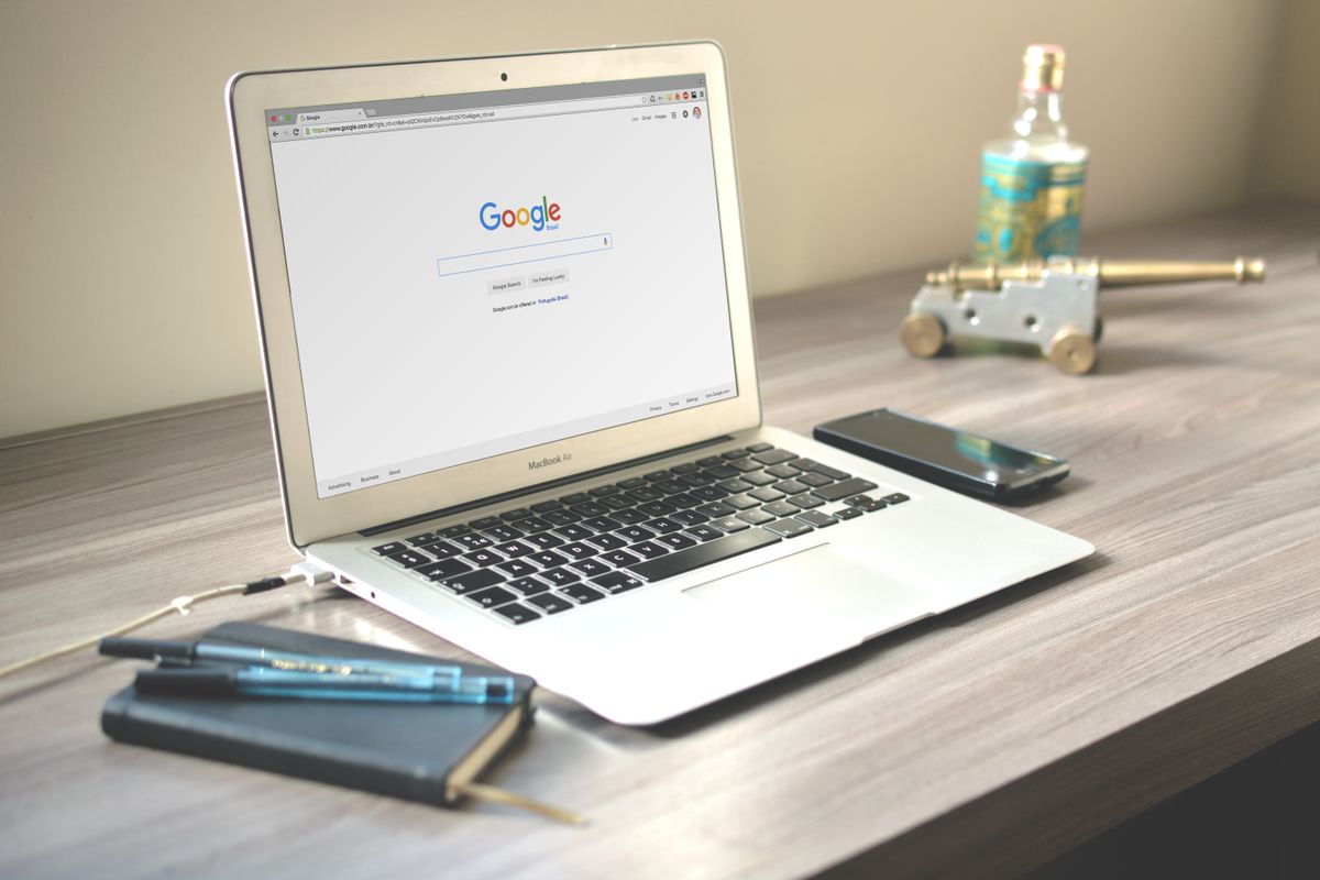 Digital tools and laptop on an estate agent desk